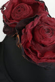 Elegant svart crop top med röd blomma