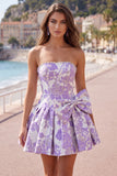Axelbandslös lila A-linje Pearls Jacquard hemkomstklänning med rosett