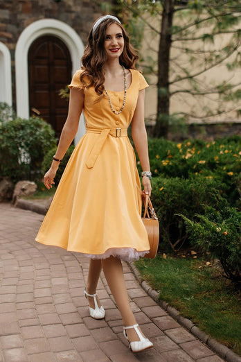 Rund hals gul vintageklänning med knapp