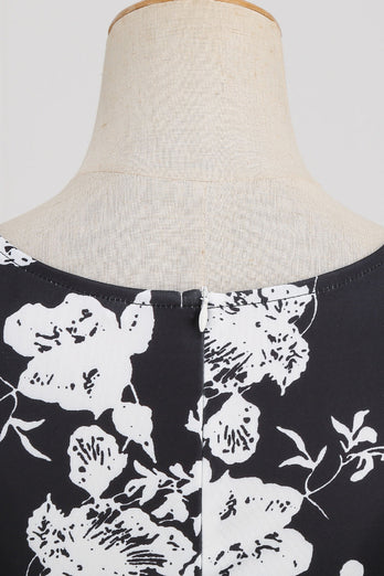 Svart V-halsat tryck ärmlös klänning från 1950-talet
