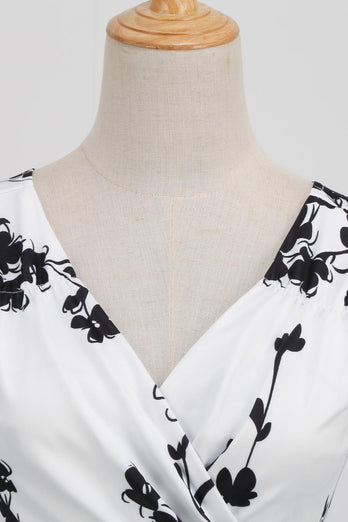 Svart V-halsat tryck ärmlös klänning från 1950-talet