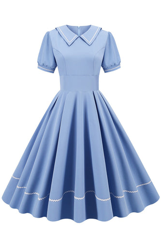 Retro stil blå 1950 -talsklänning med korta ärmar