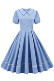 Retro stil blå 1950 -talsklänning med korta ärmar