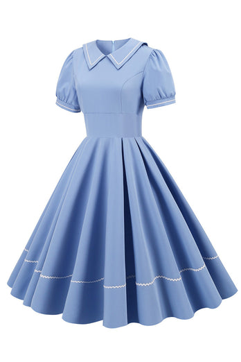 Retro stil blå 1950 -talsklänning med korta ärmar