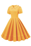 Retro stil blå 1950 -talsklänning med korta ärmar