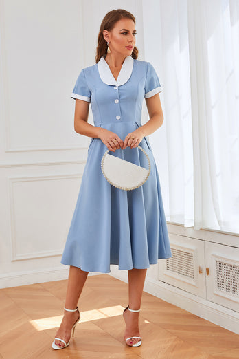 Blå swingklänning från 1950-talet med fickor