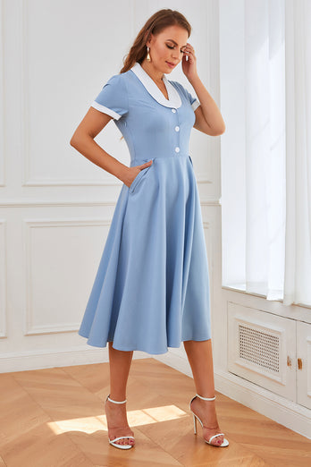 Blå swingklänning från 1950-talet med fickor
