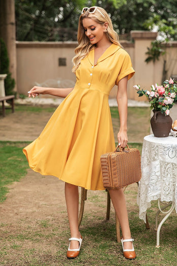 Elegant gul V-hals vintageklänning